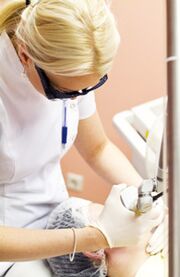 The doctor performs the photothermal procedure